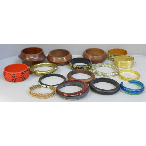 668 - A collection of sixteen bracelets including Murano, lucite with silver flakes