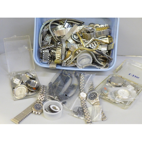 669 - A tub of watch parts and straps, etc.
