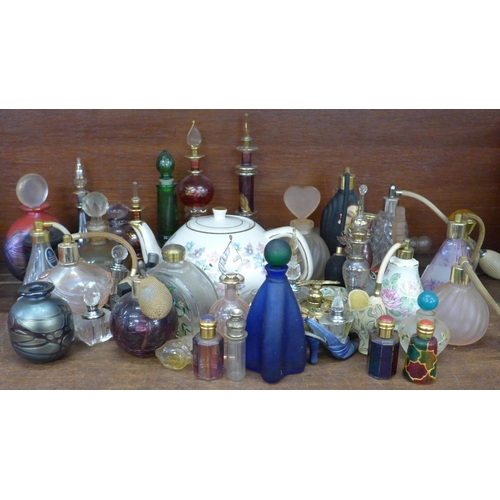 678 - A collection of approximately 40 perfume bottles and an Arthur Wood teapot **PLEASE NOTE THIS LOT IS... 