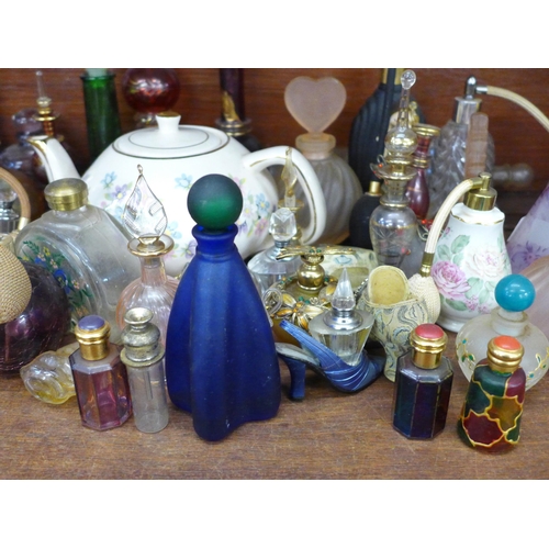 678 - A collection of approximately 40 perfume bottles and an Arthur Wood teapot **PLEASE NOTE THIS LOT IS... 