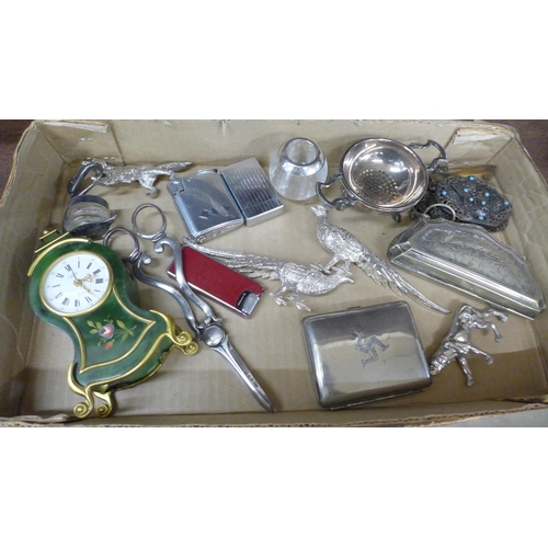 682 - A collection of plated ware including a cigarette case, purse, and a small 8-day Swiss musical clock