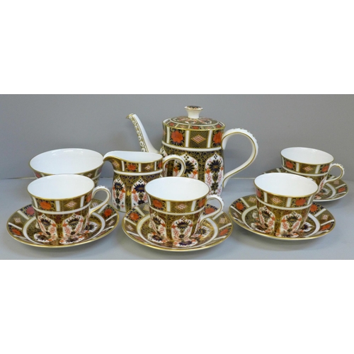 689 - A Royal Crown Derby 1128 Imari tea set - four cups and saucers, a milk jug, (second) a sugar bowl an... 