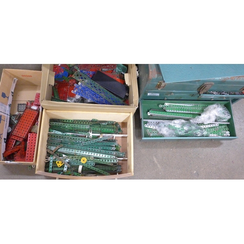 696 - A metal tool cabinet containing Meccano parts and three boxes of loose Meccano