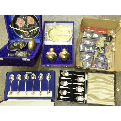 706 - A collection of souvenir spoons, two boxed sets of silver plated spoons, an enamelled cruet set and ... 