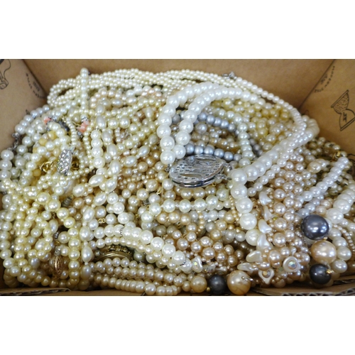 729 - A box of faux pearl necklets