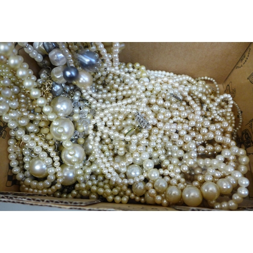 729 - A box of faux pearl necklets