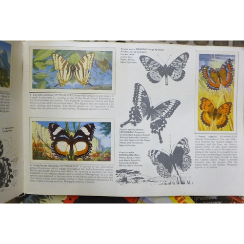 738 - A collection of Brooke Bond picture card albums, pre-historic animals, famous people, butterflies, f... 