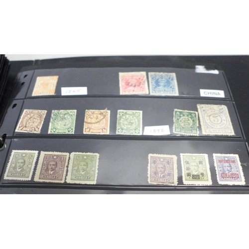 740 - Two albums of stamps; one album of mainly mint GB stamps and the other including early China, Chile,... 