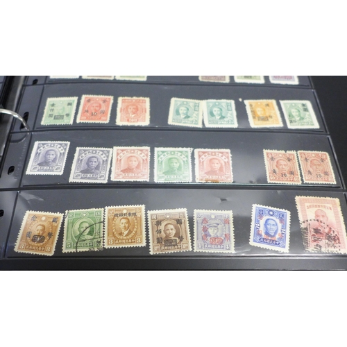 740 - Two albums of stamps; one album of mainly mint GB stamps and the other including early China, Chile,... 