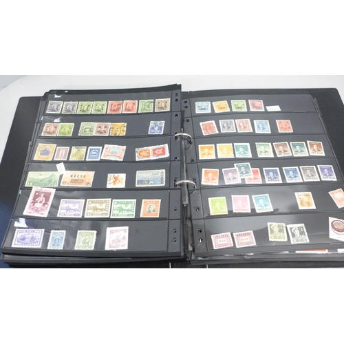 740 - Two albums of stamps; one album of mainly mint GB stamps and the other including early China, Chile,... 