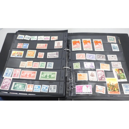 740 - Two albums of stamps; one album of mainly mint GB stamps and the other including early China, Chile,... 