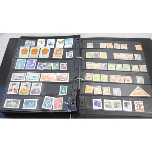 740 - Two albums of stamps; one album of mainly mint GB stamps and the other including early China, Chile,... 