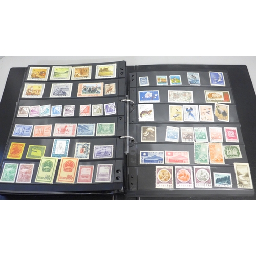 740 - Two albums of stamps; one album of mainly mint GB stamps and the other including early China, Chile,... 