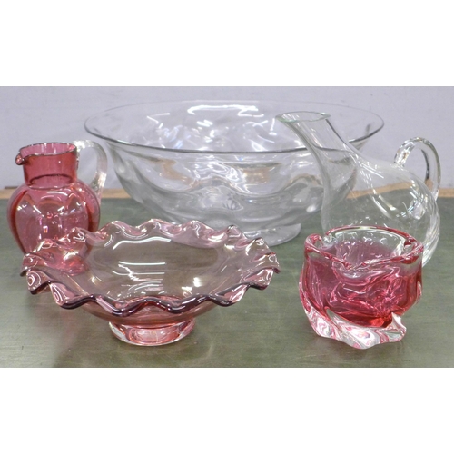 757 - A large crystal punch bowl, 38cm diameter, a heavy cased cranberry art glass vase, two pieces of cra... 