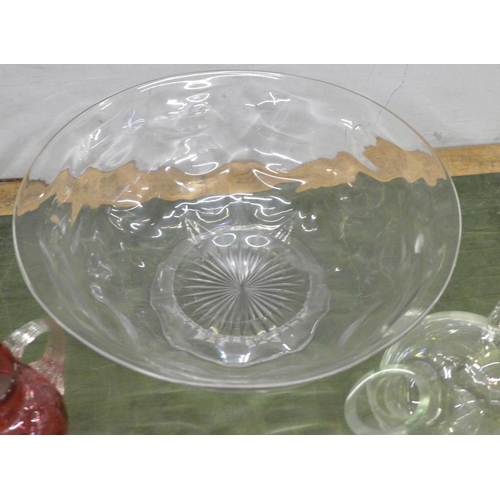 757 - A large crystal punch bowl, 38cm diameter, a heavy cased cranberry art glass vase, two pieces of cra... 