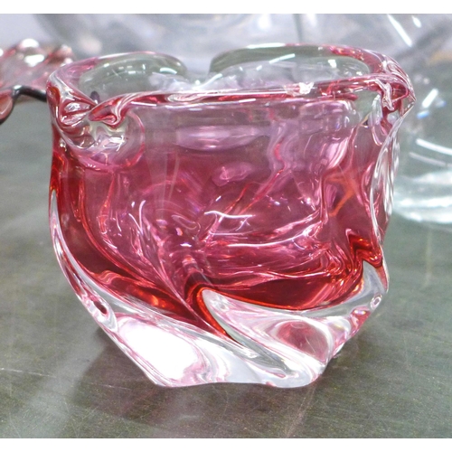 757 - A large crystal punch bowl, 38cm diameter, a heavy cased cranberry art glass vase, two pieces of cra... 