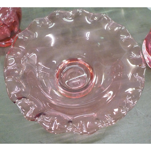 757 - A large crystal punch bowl, 38cm diameter, a heavy cased cranberry art glass vase, two pieces of cra... 