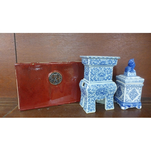 763 - A Chinese blue and white lion lidded opium jar, a Chinese blue and white square alter vase and a Chi... 