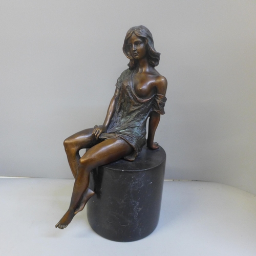 764 - After Jean Patoue, a bronze nude on a black marble plinth, 26.5cm