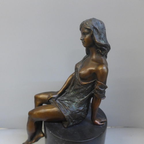 764 - After Jean Patoue, a bronze nude on a black marble plinth, 26.5cm