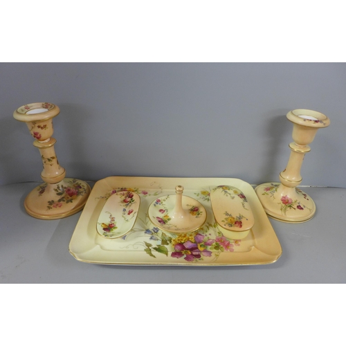 766 - A Royal Worcester dressing table set, blush ivory with floral detail including a pair of candlestick... 