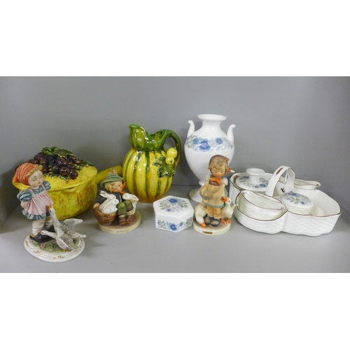 767 - Two Hummel figures, a Wedgewood Clementine dressing table set comprising of a vase, two candle holde... 