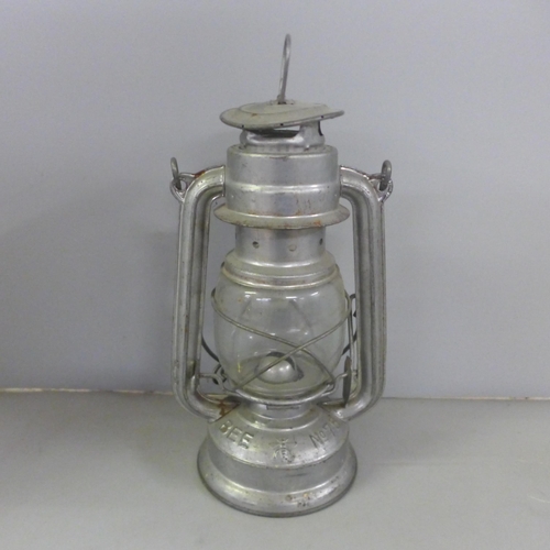 772 - An Eccles miner's lamp, W.E Teale Swinton Lancs lamp, miniature lamp and one other