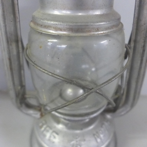 772 - An Eccles miner's lamp, W.E Teale Swinton Lancs lamp, miniature lamp and one other