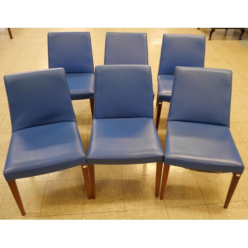 64 - A set of six G-Plan Danish Design teak and blue vinyl dining chairs, designed by Ib Kofod Larsen