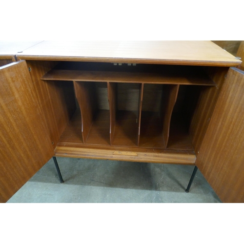 68 - A tola wood fitted three door sideboard