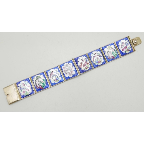 981 - An enamel panel bracelet with hand painted decoration, 19cm