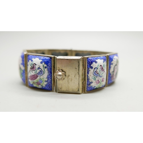 981 - An enamel panel bracelet with hand painted decoration, 19cm