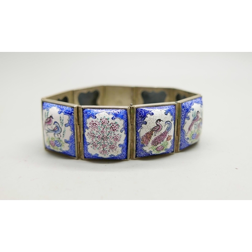 981 - An enamel panel bracelet with hand painted decoration, 19cm