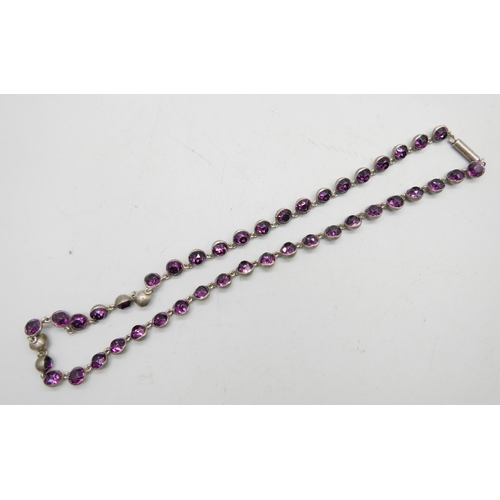 982 - A white metal necklace set with purple paste stones, 39cm