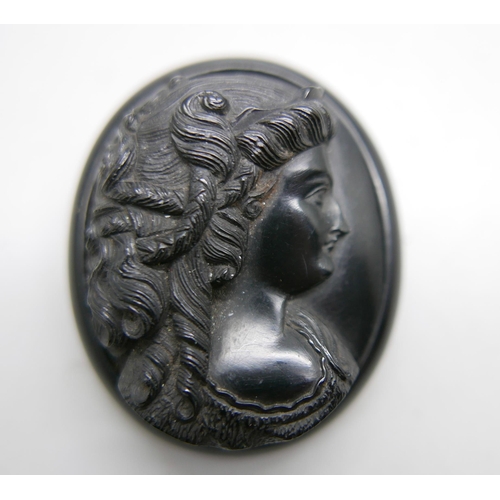 983 - A carved jet cameo portrait brooch, 5.5cm x 4.4cm, 27g