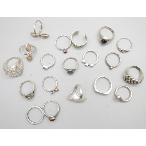 987 - A collection of nineteen silver and white metal rings, 93g