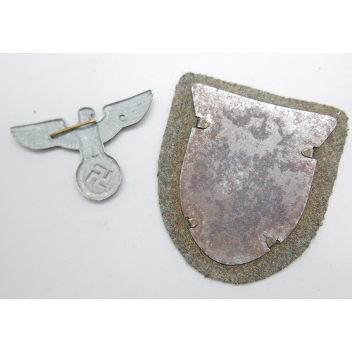 989 - A German WWII Kuban 1943 metal badge and one other German badge