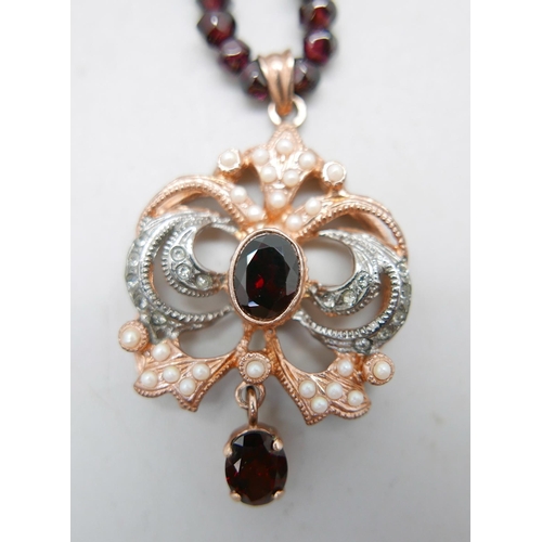 992 - A silver rose gold gilt and stone set pendant on a bead necklace with a silver gilt clasp, 28g total