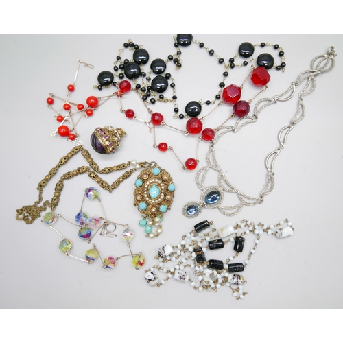 996 - Seven vintage costume necklaces including glass beads, and a decorative pendant