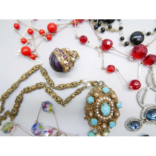 996 - Seven vintage costume necklaces including glass beads, and a decorative pendant