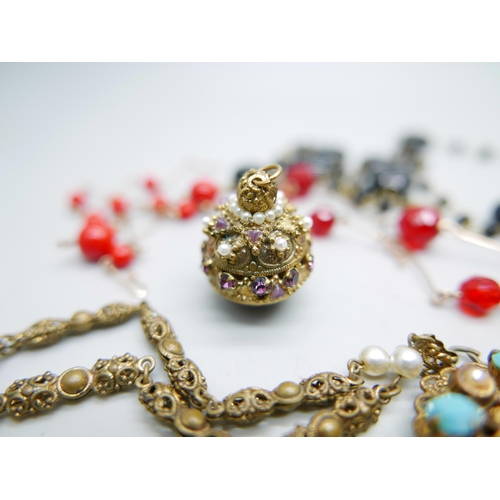 996 - Seven vintage costume necklaces including glass beads, and a decorative pendant