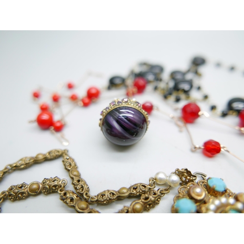 996 - Seven vintage costume necklaces including glass beads, and a decorative pendant