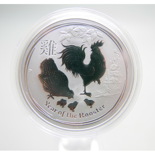 999 - A 1oz silver proof Year of The Rooster coin, and a 2004 silver proof one dollar coin