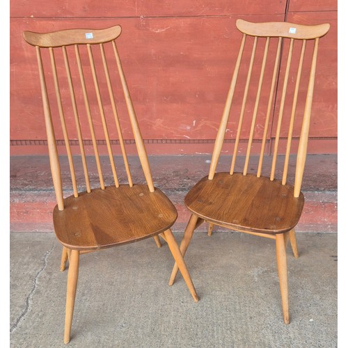 76 - A pair of Ercol Blonde elm and beech Goldsmith chairs