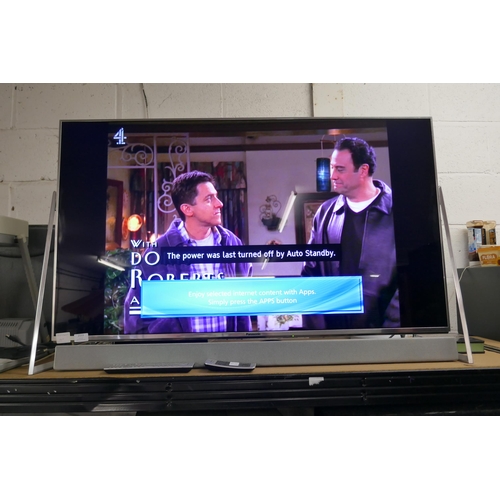 2113 - A Panasonic Smart 50” 4K UHD TV (TX-50DX802B) with sound bar and 2 remote controls