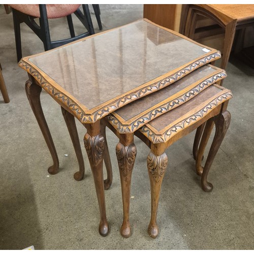 164 - A Queen Anne style burr walnut nest of tables