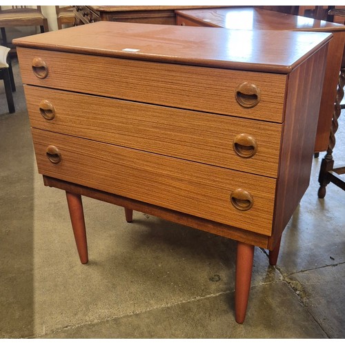 133 - A teak chest of drawers