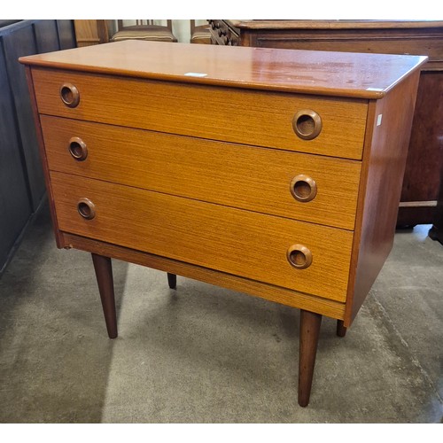 134 - A teak chest of drawers