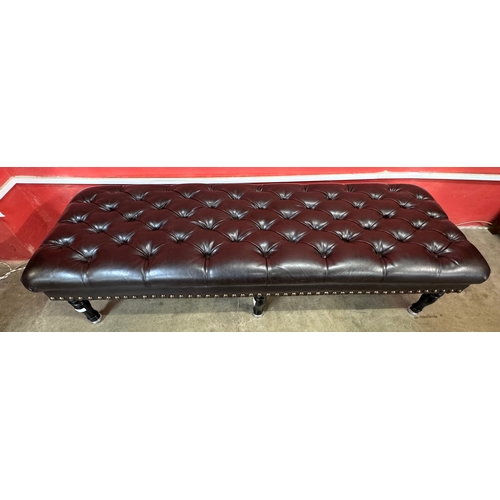 147 - A Regency style black leather footstool