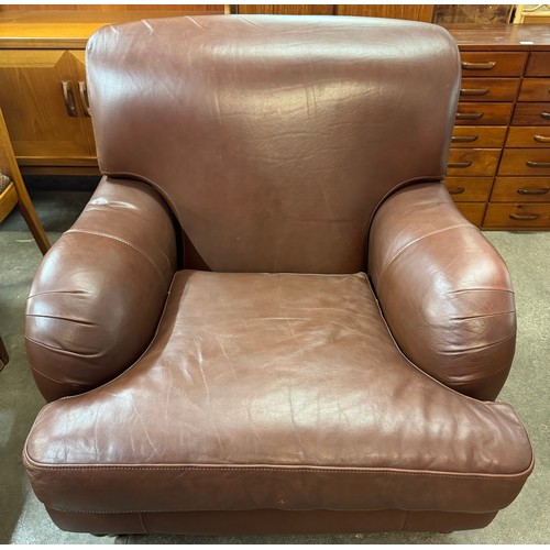 146 - A brown leather armchair